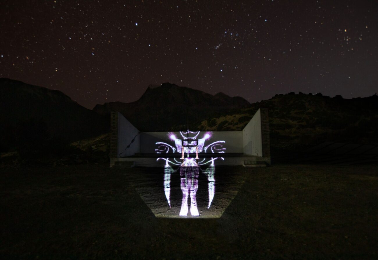 emma x zhang art Manang Neon Bug Landscape mountain light installation, abstract symmetrical bug creation